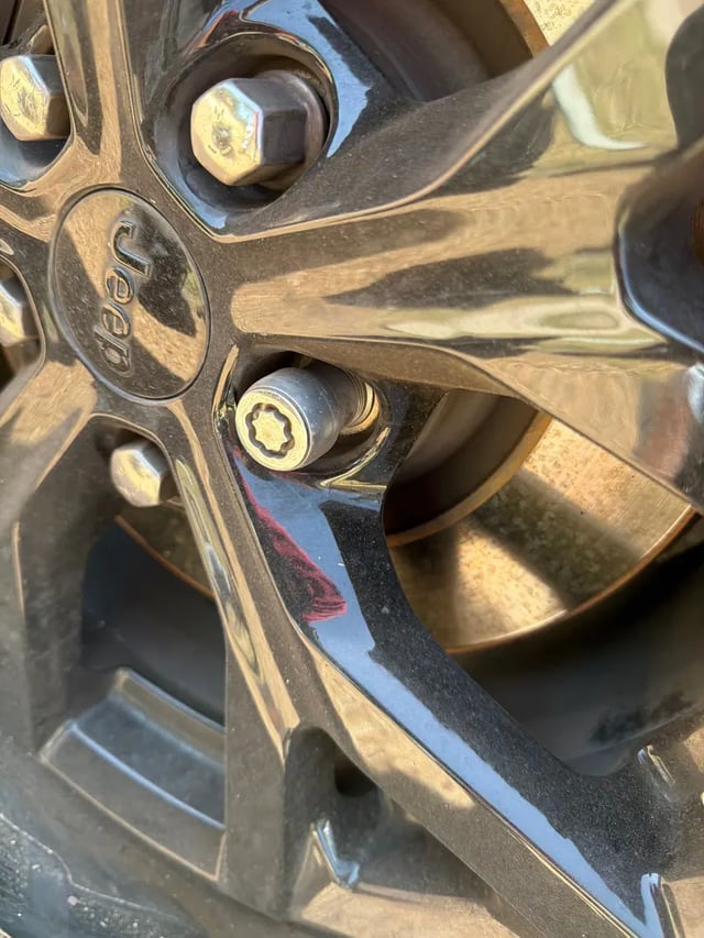 Jeep Grand Cherokee wheel-lock lug nut removed roadside without the McGard key by All Hours Roadside in Austin, TX