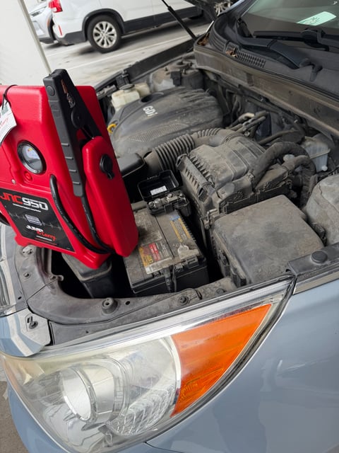 Hyundai SUV jump-started roadside in Austin TX with a JNC950 12V Jump-N-Carry booster pack on the dead OEM battery — All Hours Roadside mobile battery boost